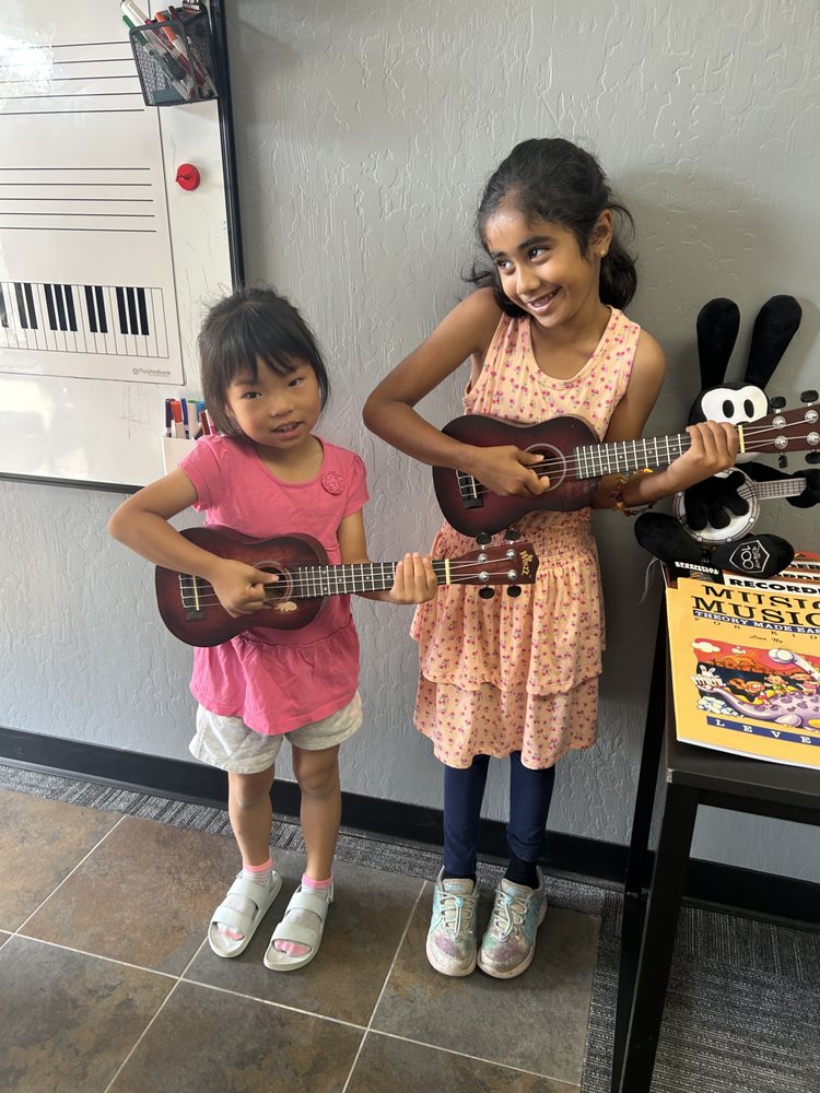 Girls playing ukulele